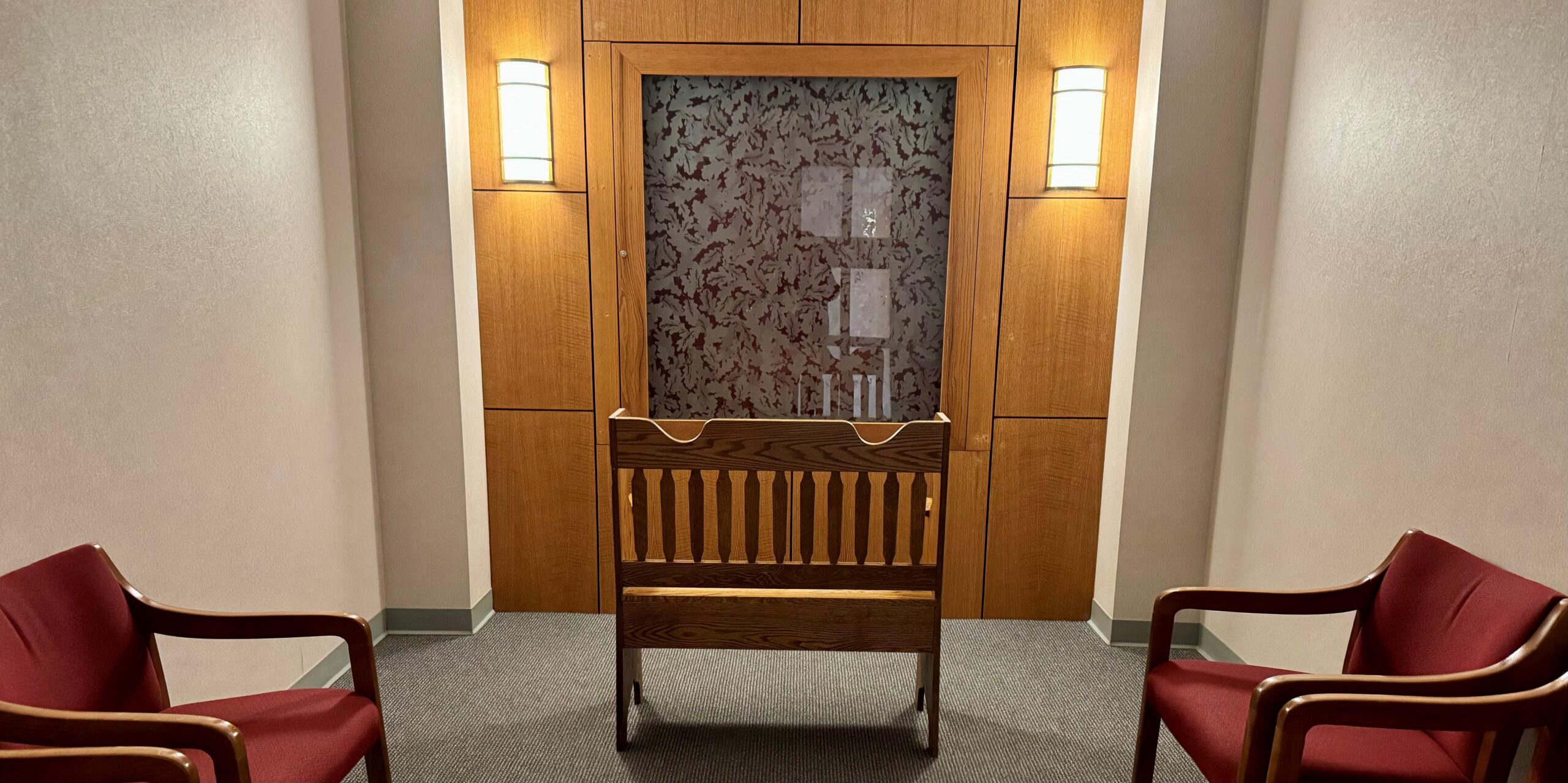 Interior view of the Oaklawn Hospital chapel with wooden accents and seating.